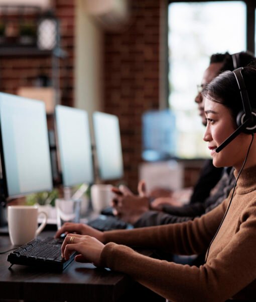 Paralyzed asian employee working at call center reception